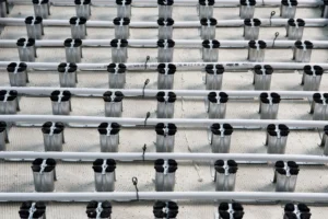 Intercell adhesive installation